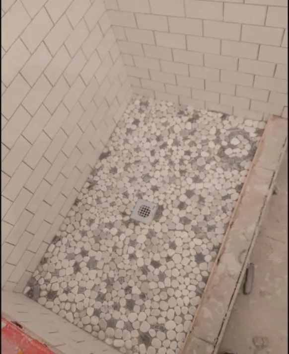 Pebble mosaic shower floor