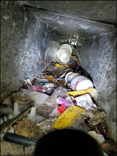 Duct full of debris — before cleaning